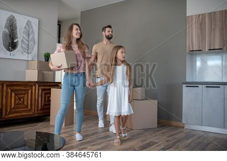 Young Cute Family Moving To The New Aprtment
