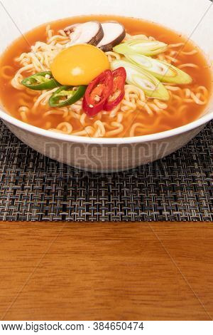 Korean Style Instant Noodle, Ramyun With Chilli And Egg Yolk On Top