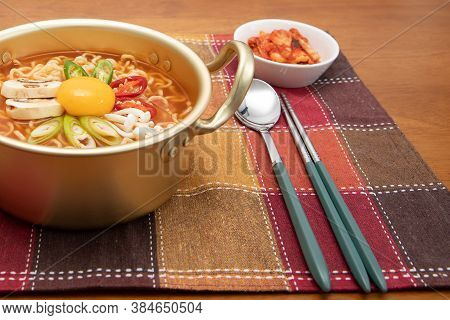 Korean Spicy Instant Noodle, Ramyun, With Egg Yolk, Kimchi Inside A Korean Noodle Pot