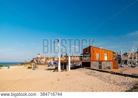 Urk Netherlands August 2020, Harbor And Lighthouse Near The Beach On A Bright Summer Day Flevoland U