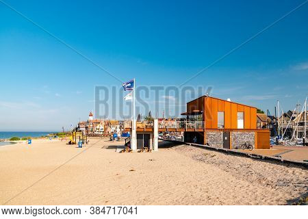 Urk Netherlands August 2020, Harbor And Lighthouse Near The Beach On A Bright Summer Day Flevoland U