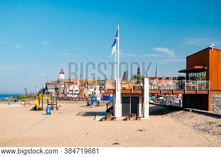 Urk Netherlands August 2020, Harbor And Lighthouse Near The Beach On A Bright Summer Day Flevoland U