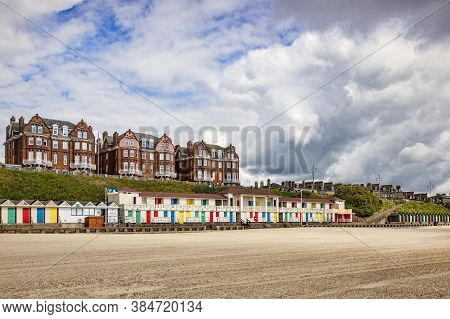 14 June 2019: Lowestoft, Suffolk, England - Beach Huts And Apartment Blocks At South Beach, Lowestof