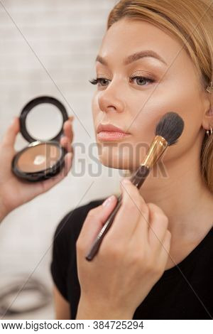 Vertical Close Up Of A Beautiful Woman Getting Professional Makeup By Beautician At The Salon