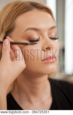 Vertical Shot Of A Professional Beautician Applying Lash Extensions On A Female Client