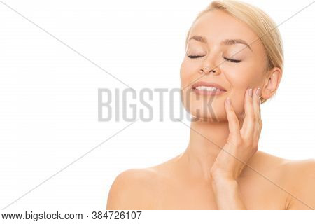 Young Gorgeous Blond Haired Woman Smiling Joyfully With Her Eyes Closed Touching Herface Gently Isol