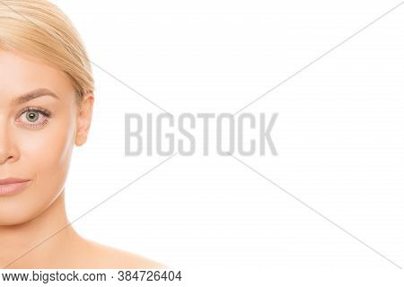 Cropped Close Up Half Of A Face Of A Gorgeous Blond Haired Woman With Unblemished Perfect Skin Isola