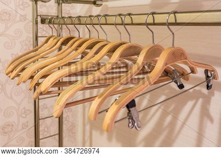 Wooden Hangers In The Closet Without Clothes