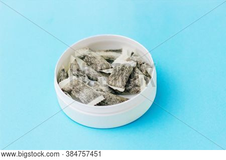 Round Box With Snus. Cigarette Substitute, Nicotine Pouches.