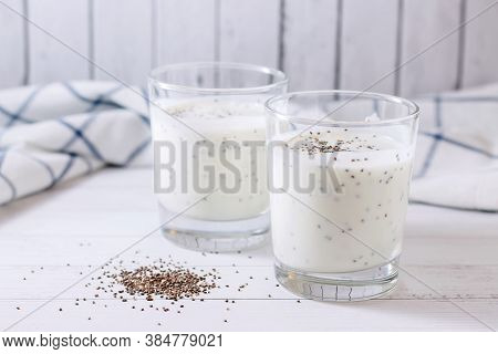 Two Servings Of Fresh Natural Homemade Organic Yogurt (ether) In Glass Glasses On A Light Background