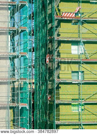 Scaffolding Arround The House To Install Thermal Insulation Of The Apartment Building Facade