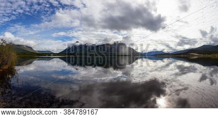 Panoramic View Of Nares Lake With Mountains In The Background During A Cloudy Morning Sunrise. Taken