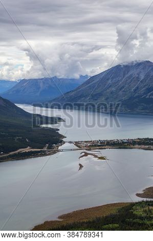 Beautiful View Of A Small Touristic Town, Carcross, Surounded By Canadian Mountain Landscape. Locate