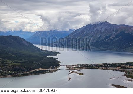 Beautiful View Of A Small Touristic Town, Carcross, Surounded By Canadian Mountain Landscape. Locate