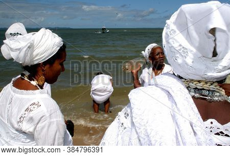 Santo Amaro, Bahia / Brazil - May 13, 2007: Candomble Supporters Are Seen During A Delivery Of Offer