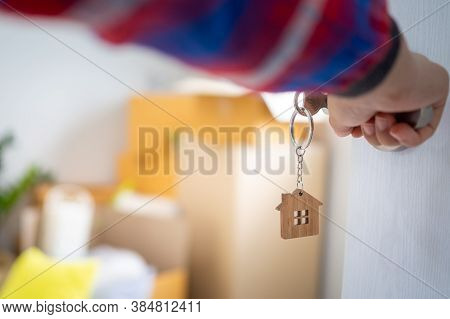 The New Home Owner Opens The Door Of The Room. Inside The Room There Are Personal Belongings That Ar