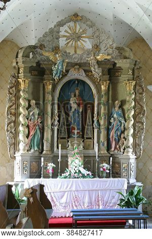 RADOBOJ, CROATIA - SEPTEMBER 21, 2014: Altar of Our Lady of the Snows in the parish church of the Holy Trinity, Radoboj, Croatia