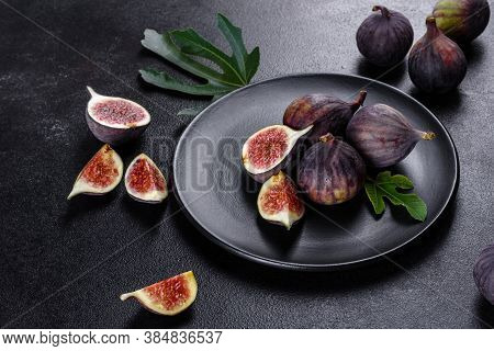 Fresh Ripe Figs On A Dark Concrete Background. Harvesting Figs