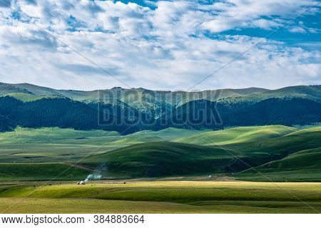 A Magnificent Landscape Of Traditional Pastures Of The Nomadic Peoples Of Asia. Yurt In The Pasture.