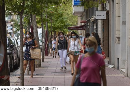 Zaragoza, Spain - August 18, 2020: People Walking With Face Masks, Due To The Coronavirus Pandemic, 