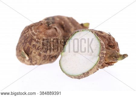 Group Of Sweet Taro Root Isolated On White Background Arbi Or Aravi Roots With One Cut In Cross Sect