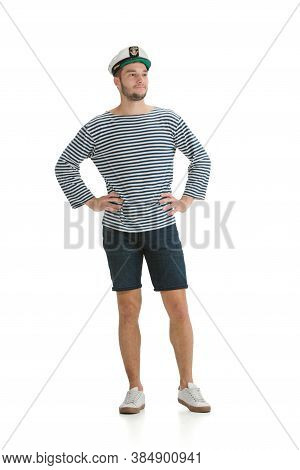 Posing Confident. Caucasian Male Sailor In Uniform On White Studio Background. Young Man Using Moder