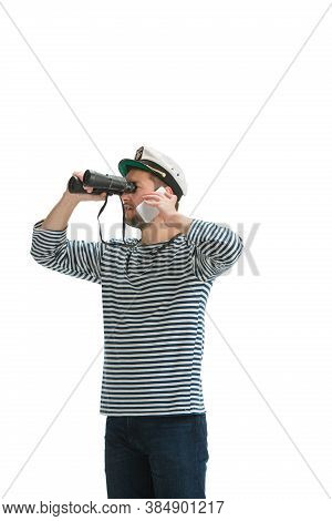 Talking Phone. Caucasian Male Sailor In Uniform On White Studio Background. Young Man Using Modern D