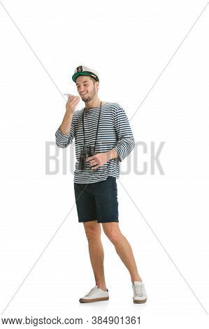 Recording Voice. Caucasian Male Sailor In Uniform On White Studio Background. Young Man Using Modern