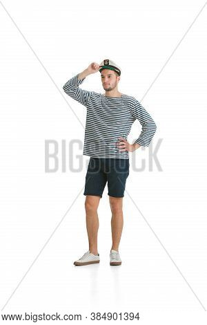 Confident Posing. Caucasian Male Sailor In Uniform On White Studio Background. Young Man Using Moder