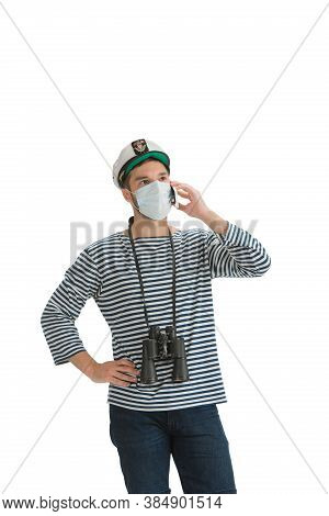 Talking Phone. Caucasian Male Sailor In Uniform On White Studio Background. Young Man Using Modern D