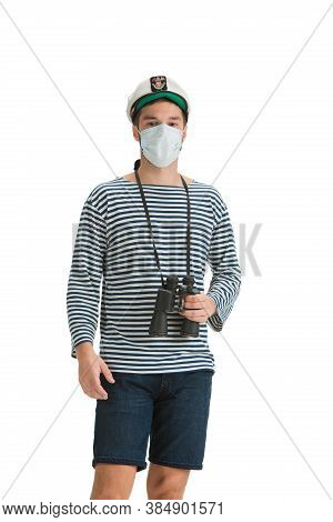 Prevention. Caucasian Male Sailor In Uniform On White Studio Background. Young Man Using Modern Devi