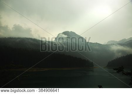 Gloomy Mountain Near The Lake, Foggy Day In The Montenegro, Travel To Europe