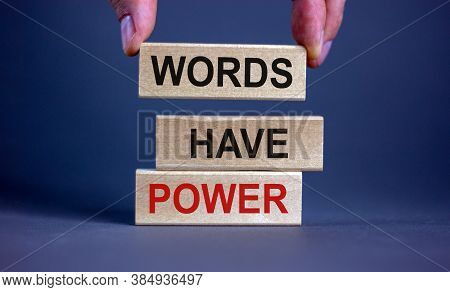 Male Hand Placing A Block With Word 'words' On Top Of A Blocks Tower With Words 'words Have Power'. 