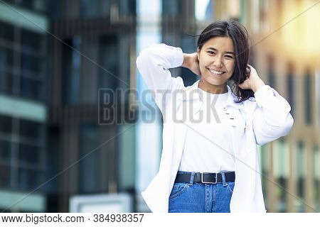 Portrait Of Asian Attractive Woman Standing Outside. Ethnic Happy Female, Student In White Shirt, Sm