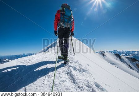 Last Steps Before Mont Blanc (monte Bianco) Summit 4,808 M Of Man With Climbing Axe Dressed Mountain