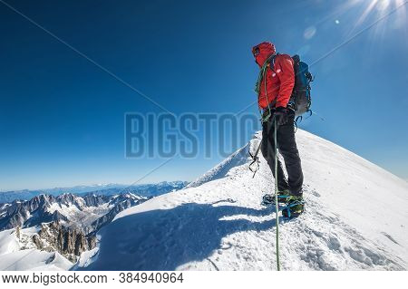 Last Steps Before Mont Blanc (monte Bianco) Summit 4,808 M Of Man With Climbing Axe Dressed Mountain