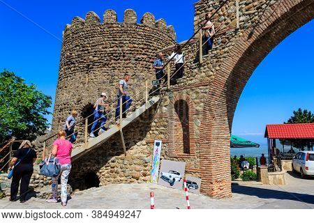 Sighnaghi, Kakheti, Georgia - May 2, 2018: Tourists Climb Up The Stairs On Old City Wall In Sighnagh