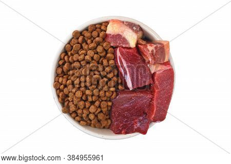 Concept Of Different Dog Or Cat Feeding Methods With Bowl Half Filled With Dry Food Kibbles And Half