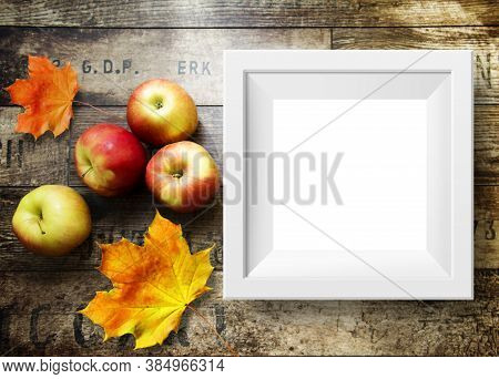 Home Background With Apples, White Frame And Wood Texture. Free Space For Your Design And Home Inter