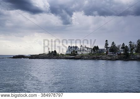Large Coastal Maine Homes On Johns Bay In Bristol Maine Under A Stormy Dramatic Sky.