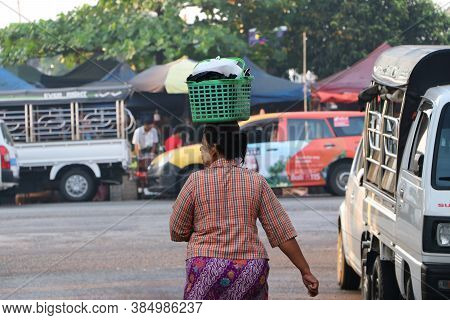 Yangon, Myanmar, Feb 24, 2019: Myanmese Woman With Thanakha (myanmar Powder) On Her Face Put The Pla