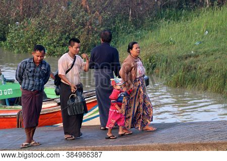 Yangon, Myanmar, Feb 25, 2019: Family Passenger Walk Together From Myanmar Traditional Ferry Across 
