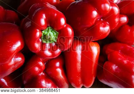 Close-up Red Bell Peppers Background With Copy Space. Ripe Red Peppers In The Kitchen. Paprika Filli
