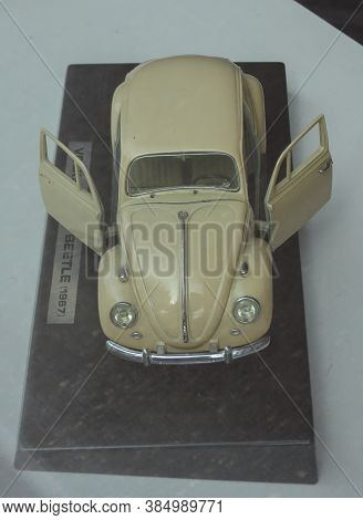 Oslo, Norway - Circa August 2017: Off White Volkswagen Beetle Car Scale Model Produced As Children T