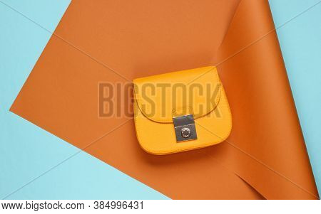 Yellow Leather Bag On Wrapped Paper Background. Pastel Color Trend, Minimalistic Beauty And Fashion 