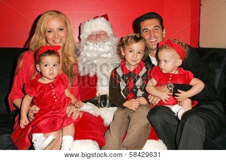 WEST HOLLYWOOD - DECEMBER 09: Cindy Margolis with Guy Starkman and children Sabrina, Nicholas and Sierra at Stuff-A-Thon benefitting Children In Crisis December 09, 2006 in Guys, West Hollywood, CA.