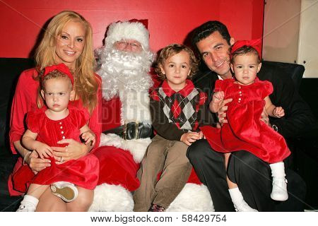 WEST HOLLYWOOD - DECEMBER 09: Cindy Margolis with Guy Starkman and children Sabrina, Nicholas and Sierra at Stuff-A-Thon benefitting Children In Crisis December 09, 2006 in Guys, West Hollywood, CA.