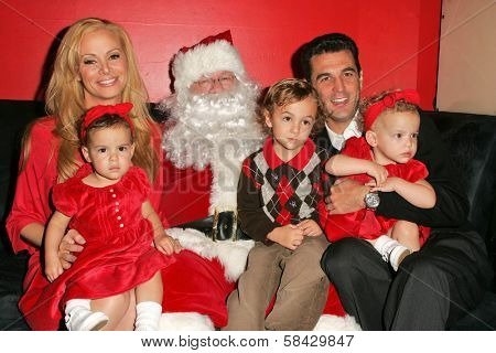 WEST HOLLYWOOD - DECEMBER 09: Cindy Margolis with Guy Starkman and children Sabrina, Nicholas and Sierra at Stuff-A-Thon benefitting Children In Crisis December 09, 2006 in Guys, West Hollywood, CA.