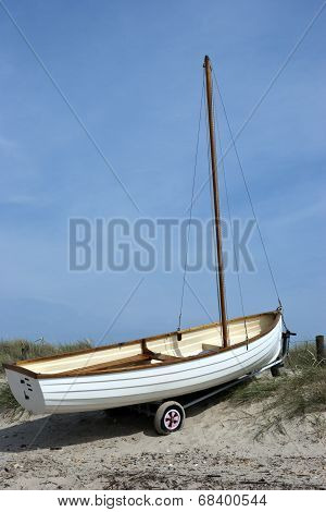 Small boat on a sandy dune