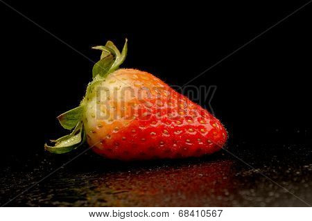 Frech Strawberries With Leaves On Black Background